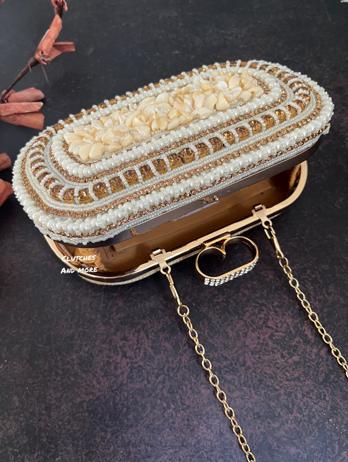 The Shell Affair capsule clutch White