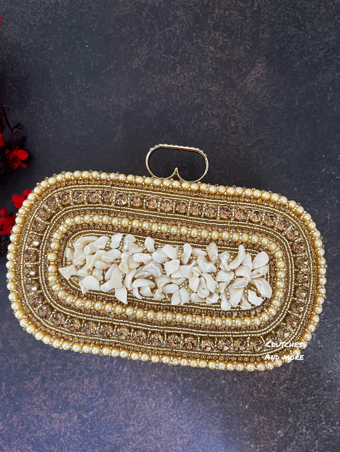 The Shell Affair capsule clutch Gold