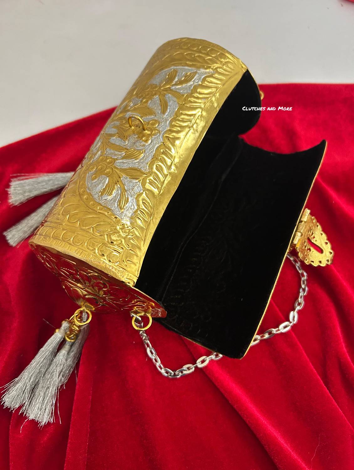Vamika Cylindrical Gold Silver Brass Clutch with Tassles