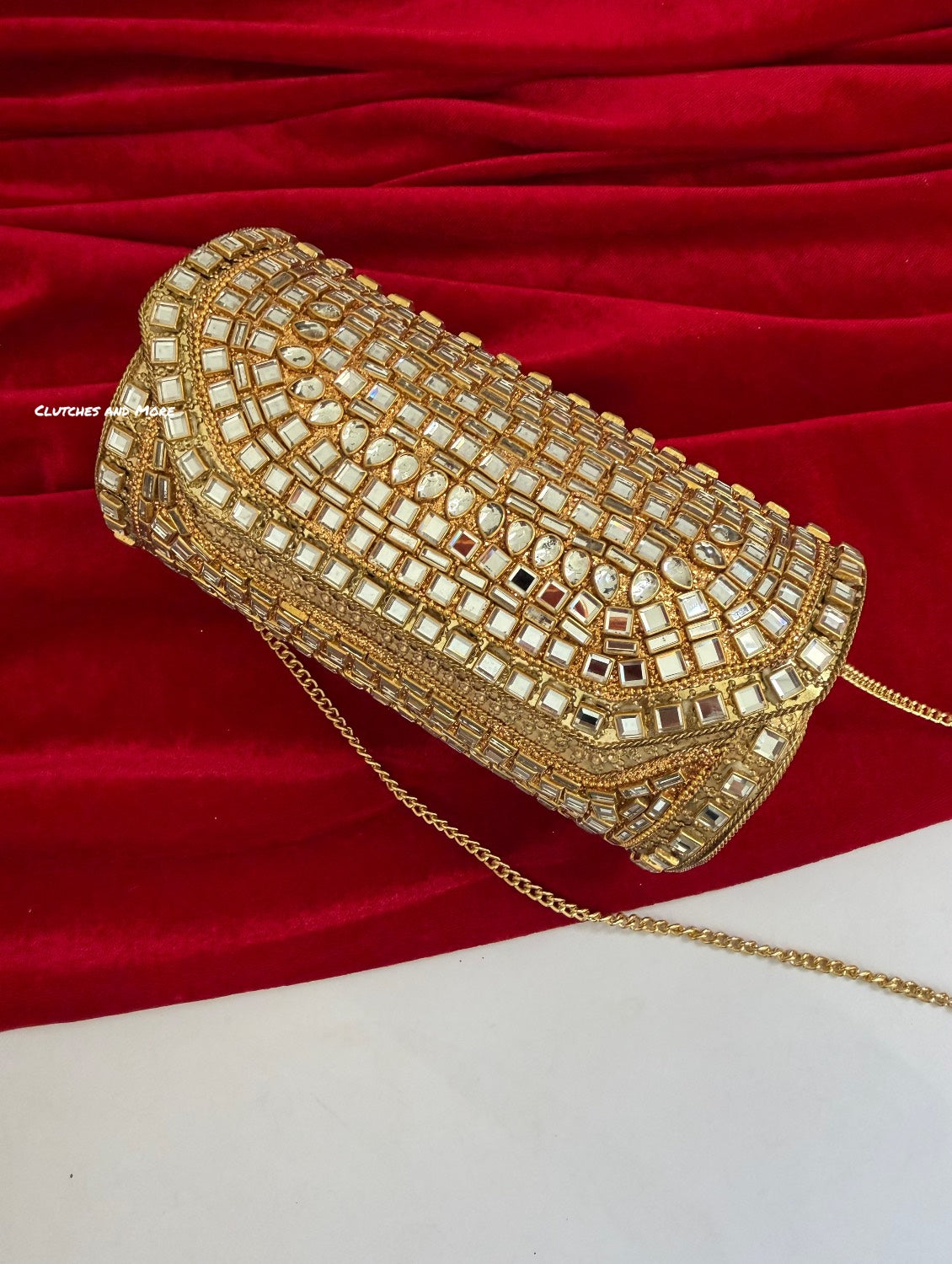 Kasika Kundan Brass Clutch Cylindrical Gold