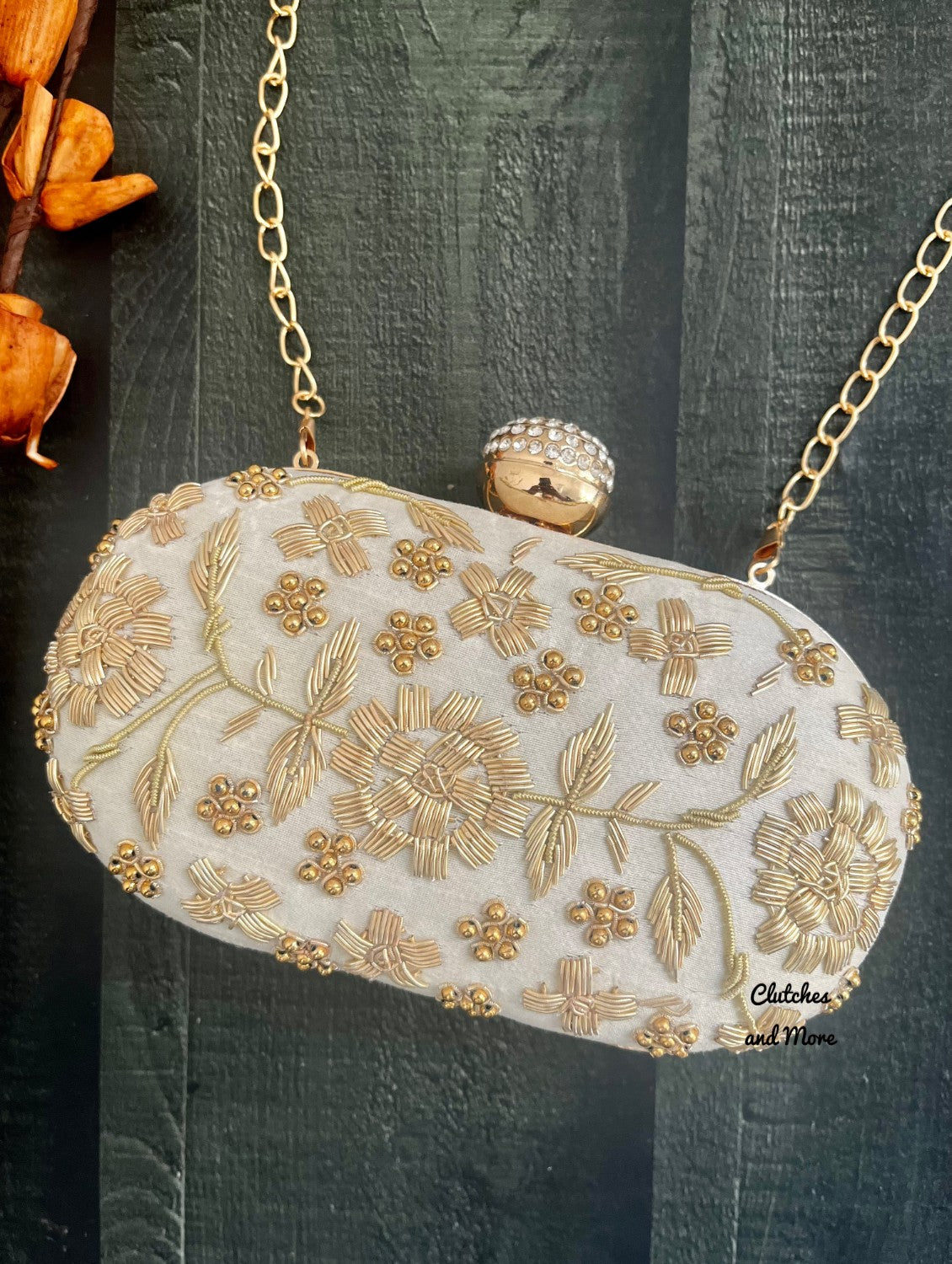 White and Gold Capsule Clutch