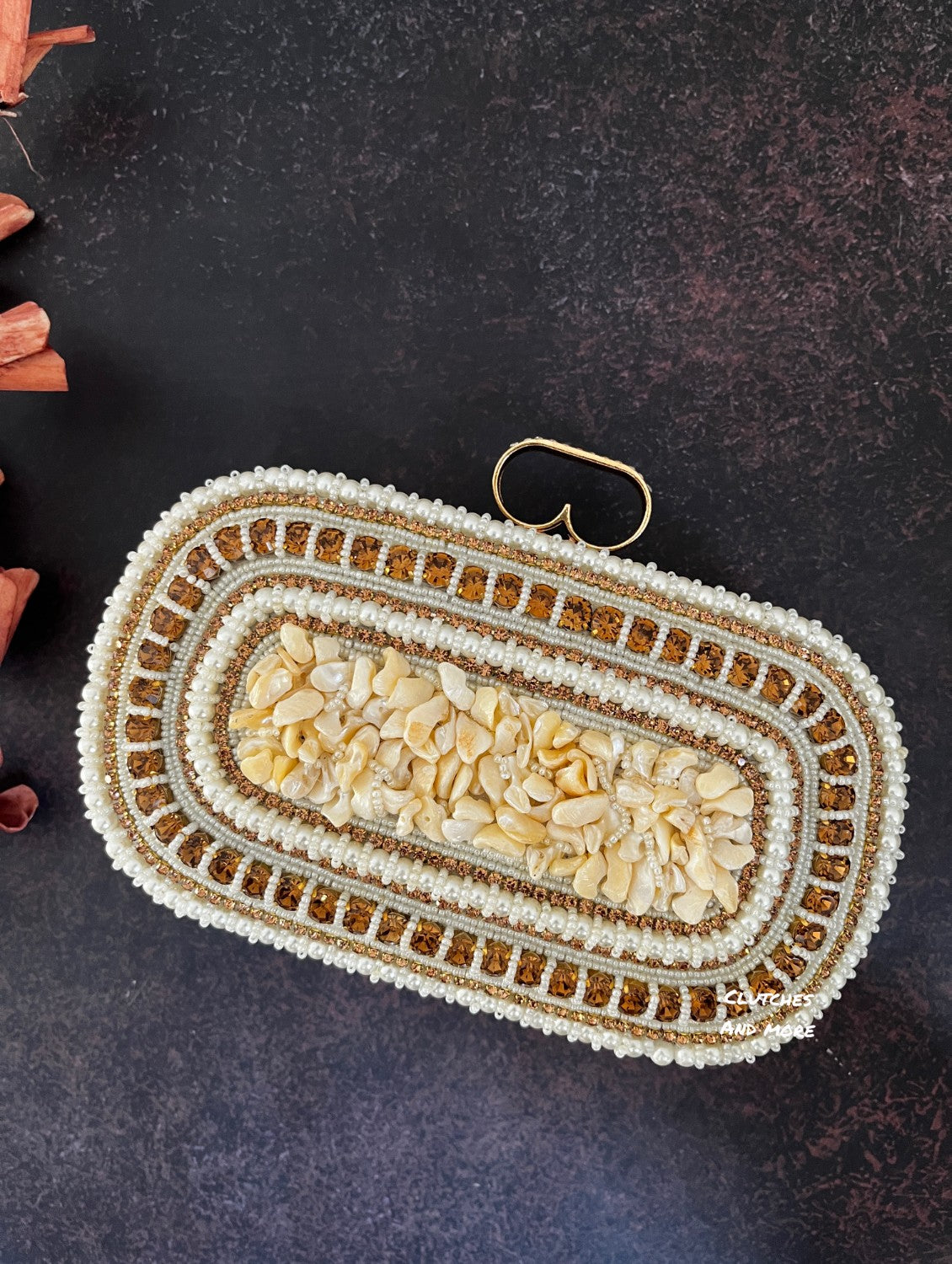 The Shell Affair capsule clutch White