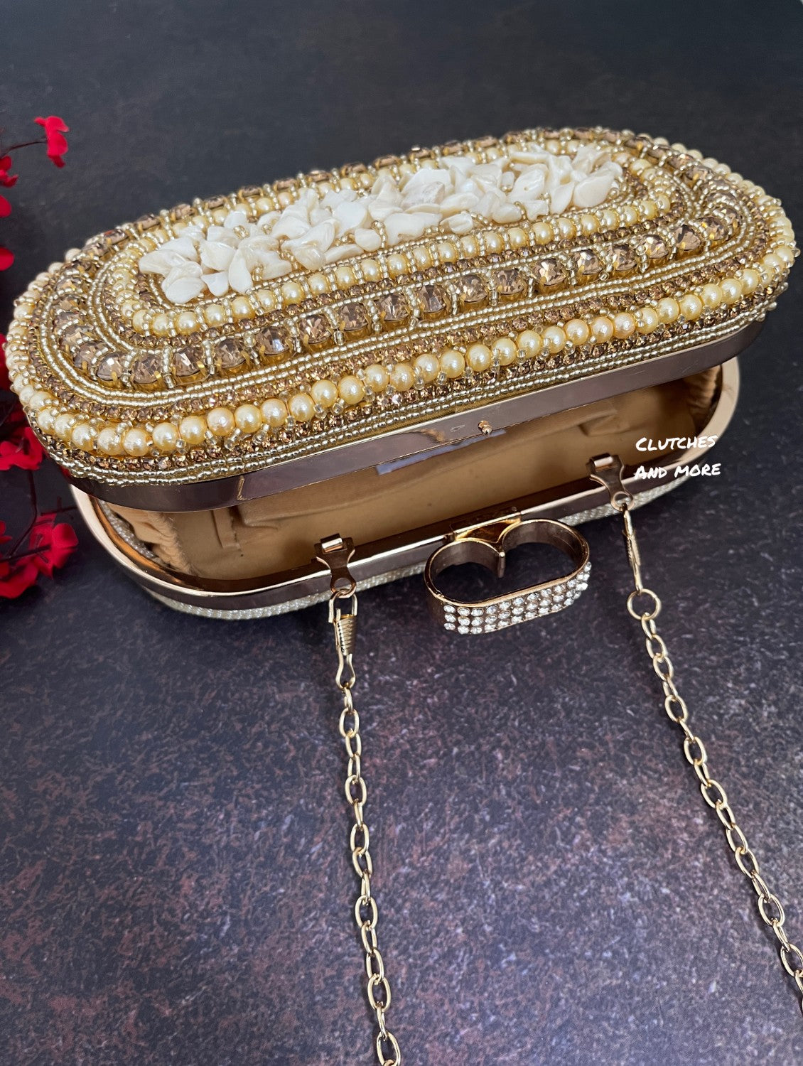 The Shell Affair capsule clutch Gold