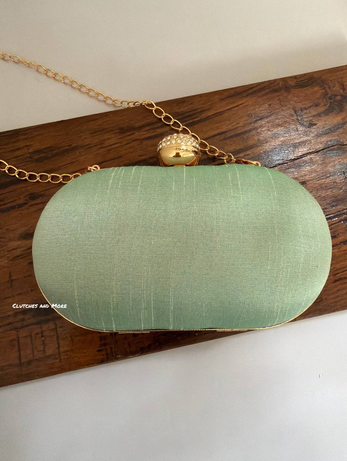 Aarohi Pastel Green Capsule Clutch