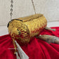 Vamika Cylindrical Gold Silver Brass Clutch with Tassles