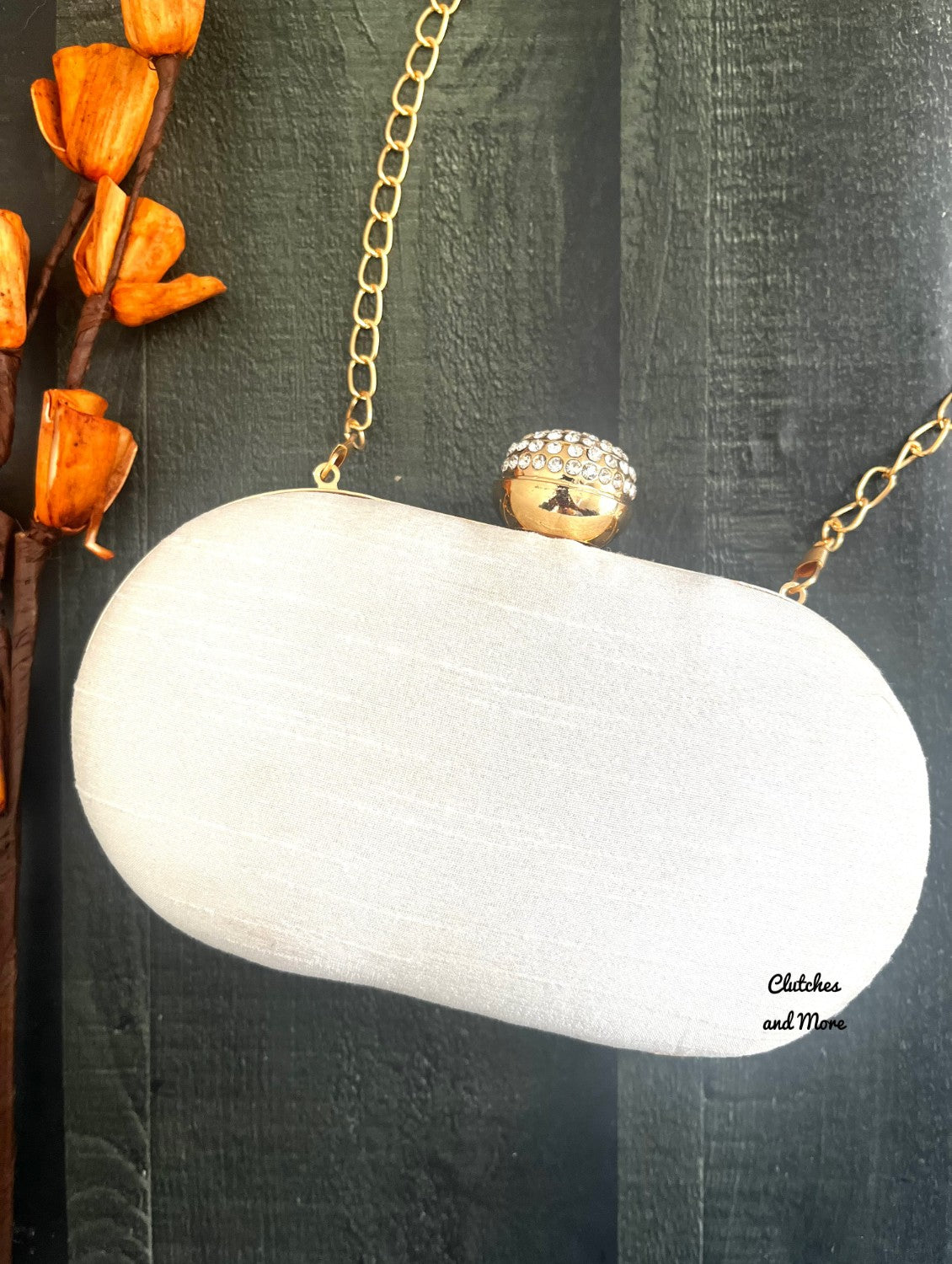 White and Gold Capsule Clutch