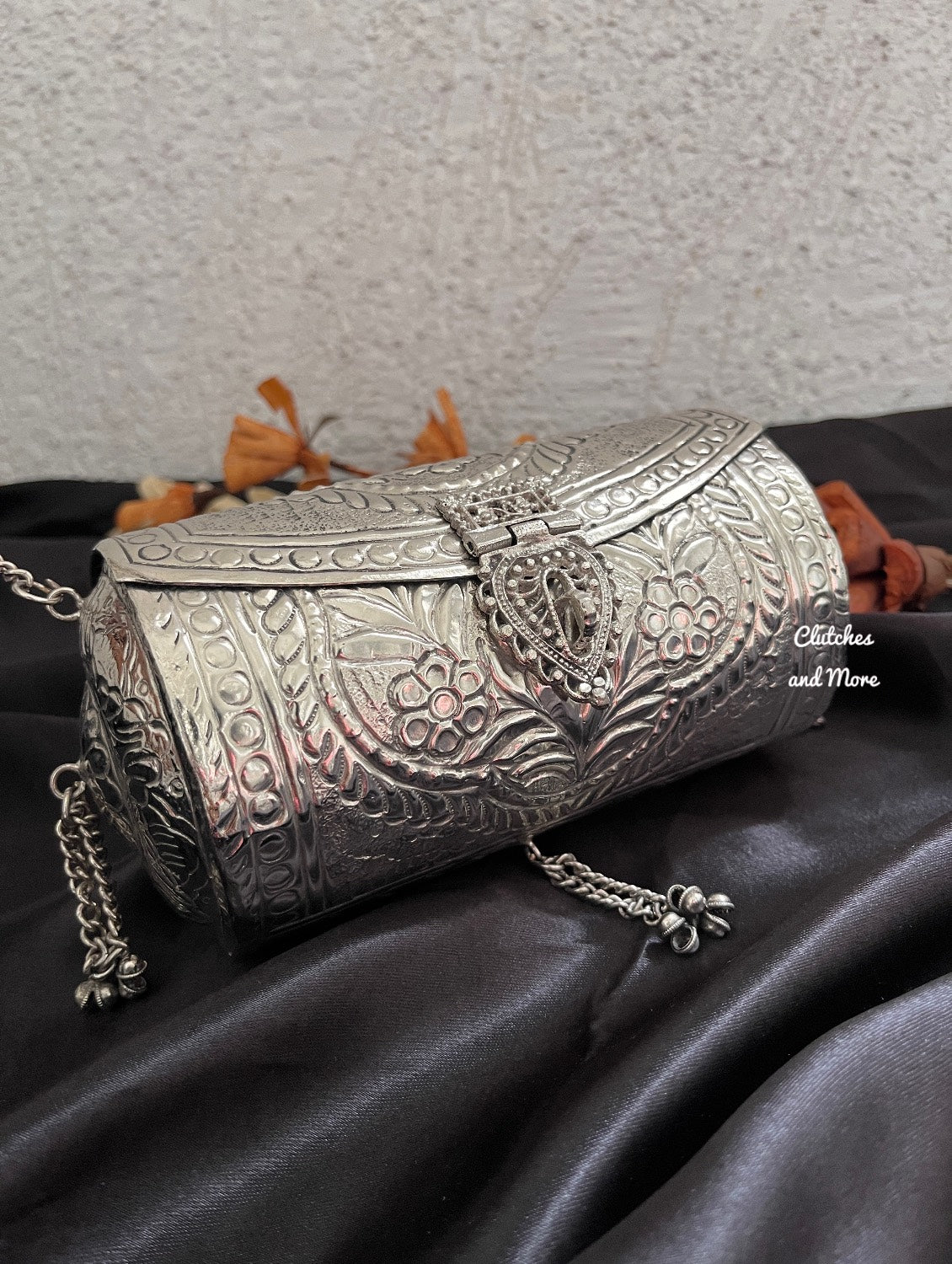 Cylindrical brass silver clutch