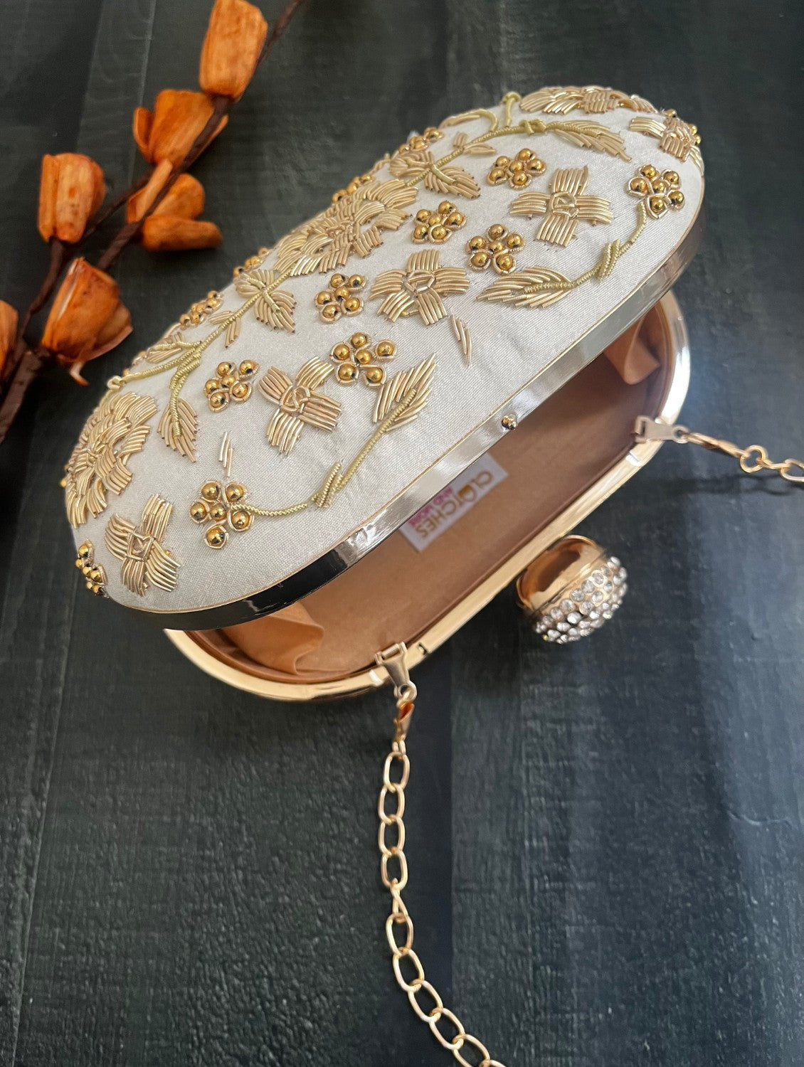 White and Gold Capsule Clutch