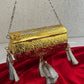 Vamika Cylindrical Gold Silver Brass Clutch with Tassles