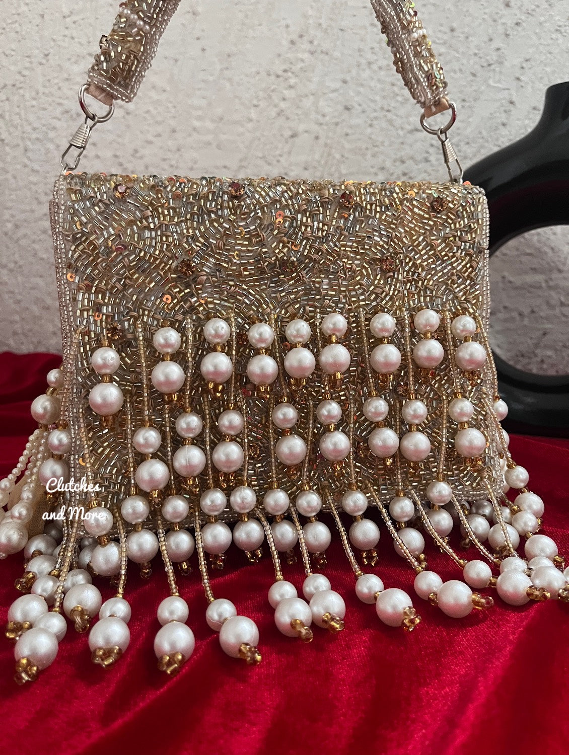 Jodha Pearl Tassle Clutch Gold