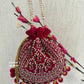 Rani Pink Ball Tassles Potli
