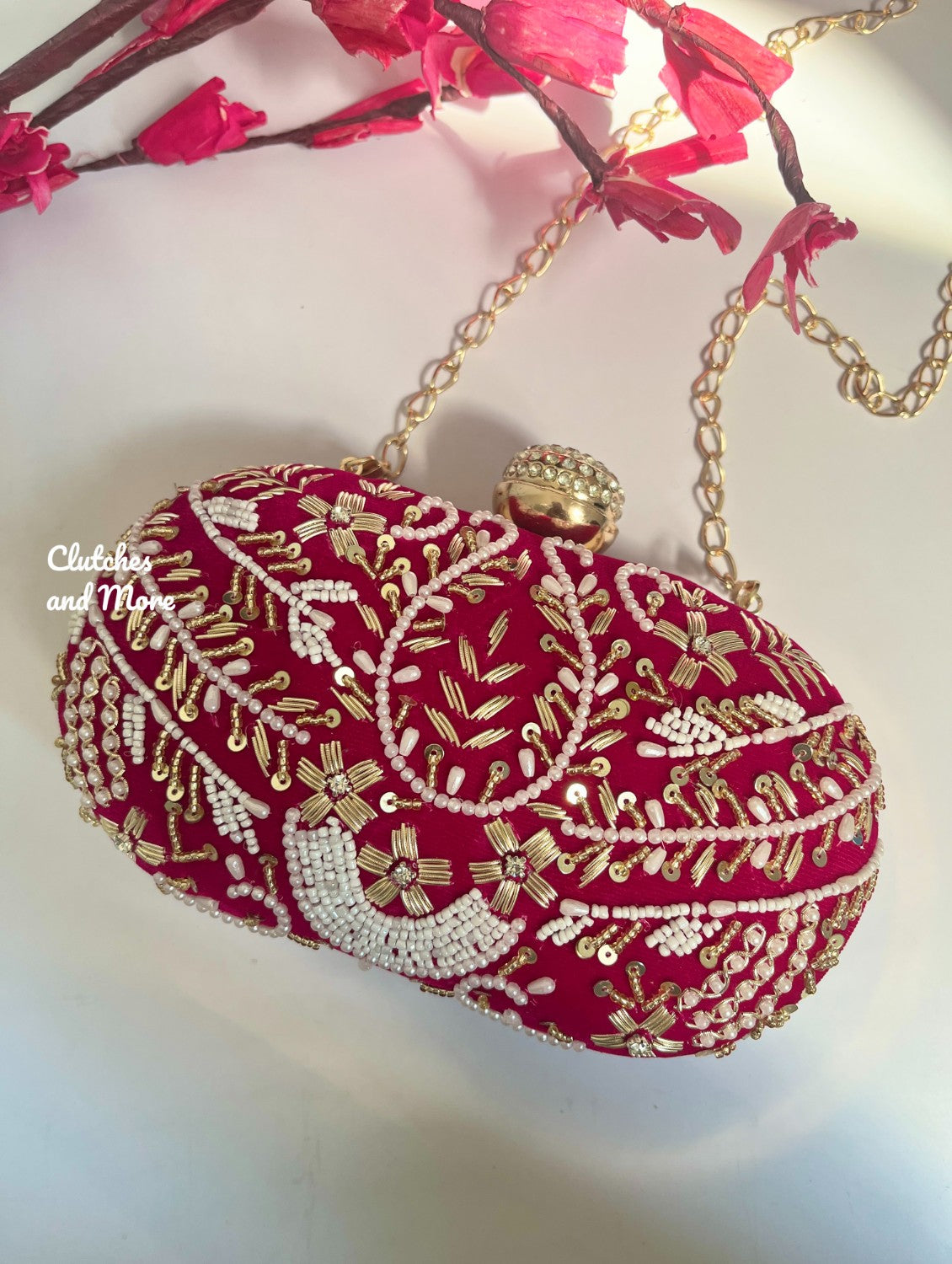 Rani Pink Capsule clutch