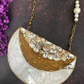 Half moon mother of pearl clutch