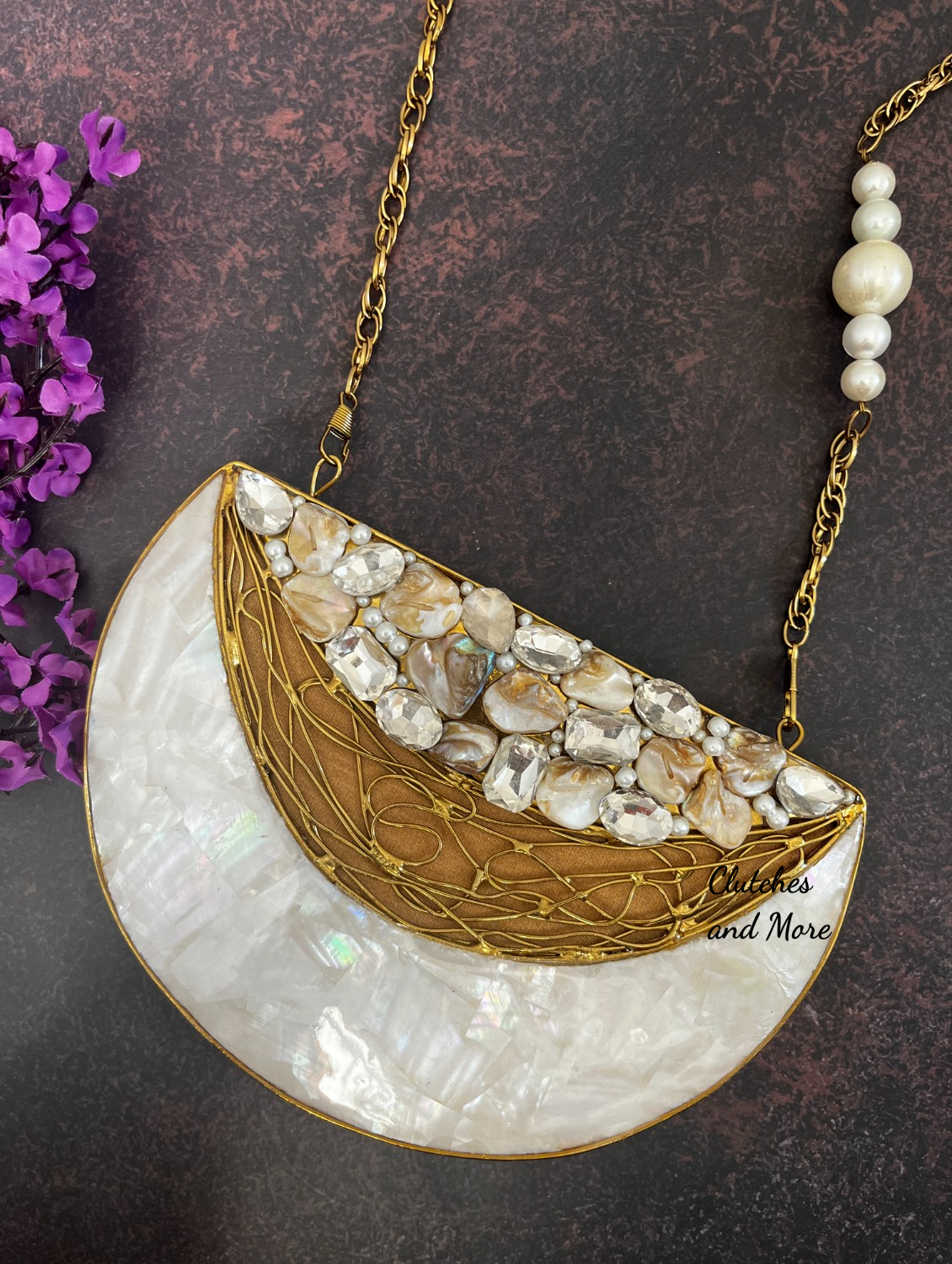 Half moon mother of pearl clutch