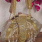 Gold and silver batua bag