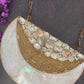 Half moon mother of pearl clutch