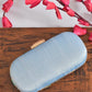 Blue capsule clutch