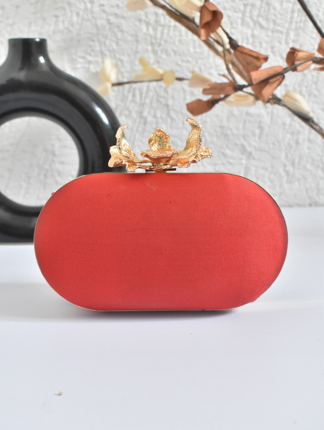 Red Capsule clutch