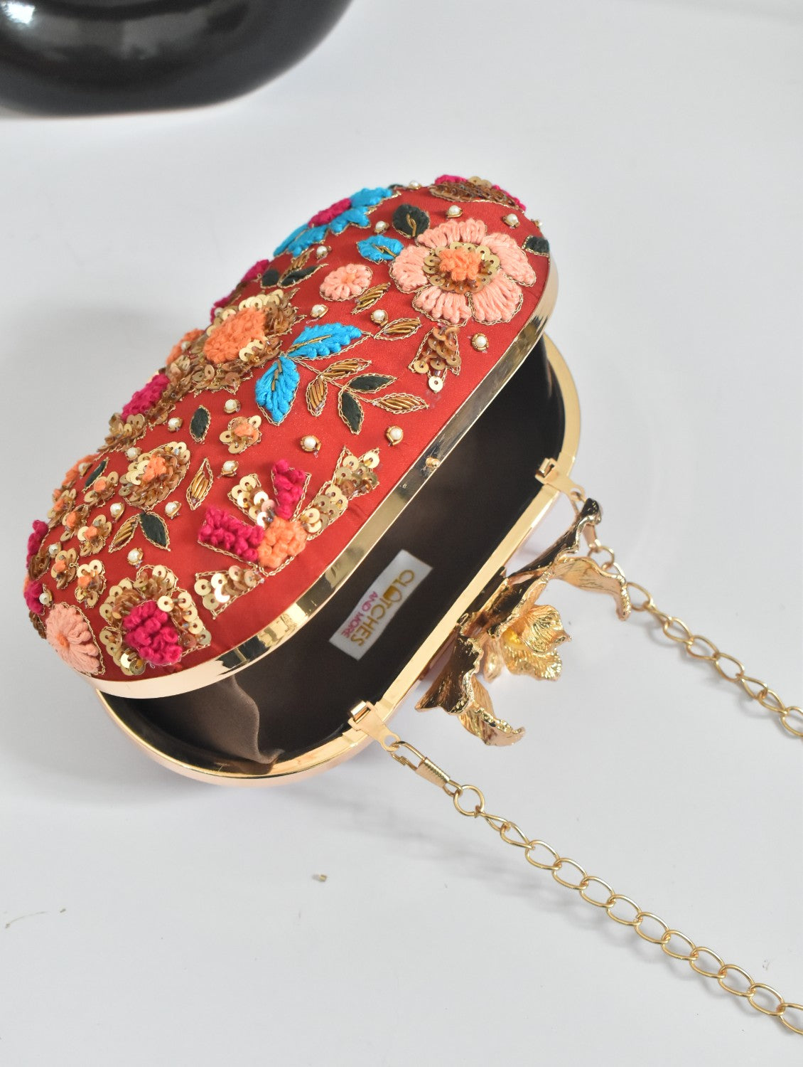 Red Capsule clutch