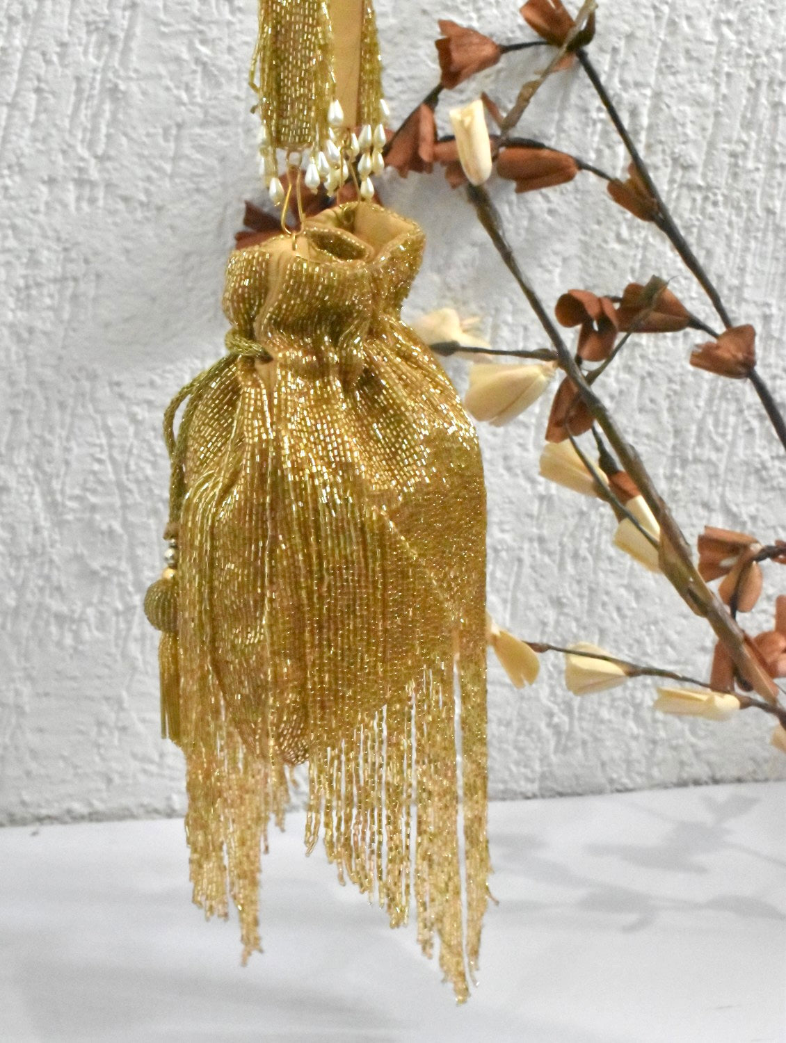 Gold tassle potli