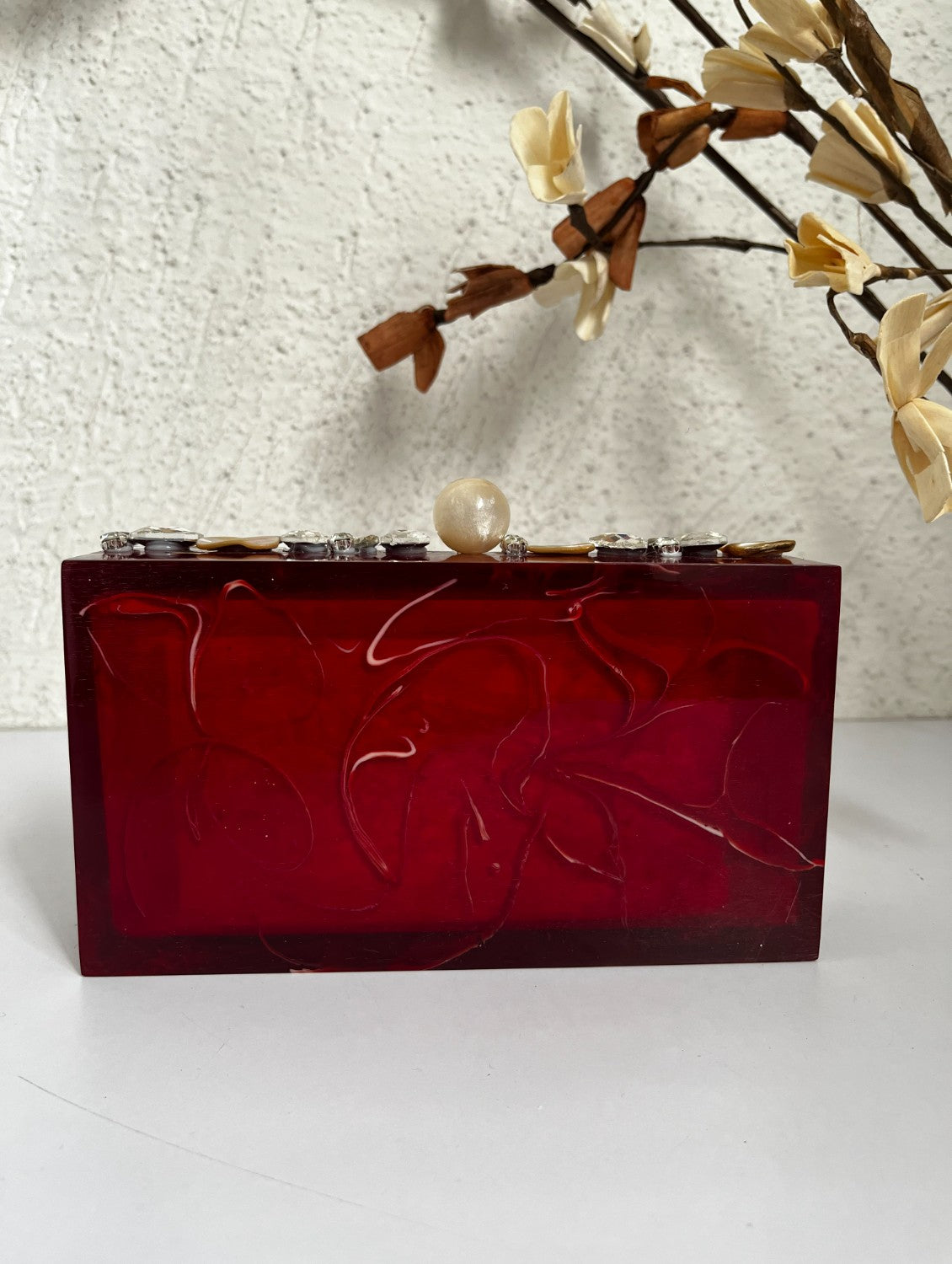 Deep red resin clutch