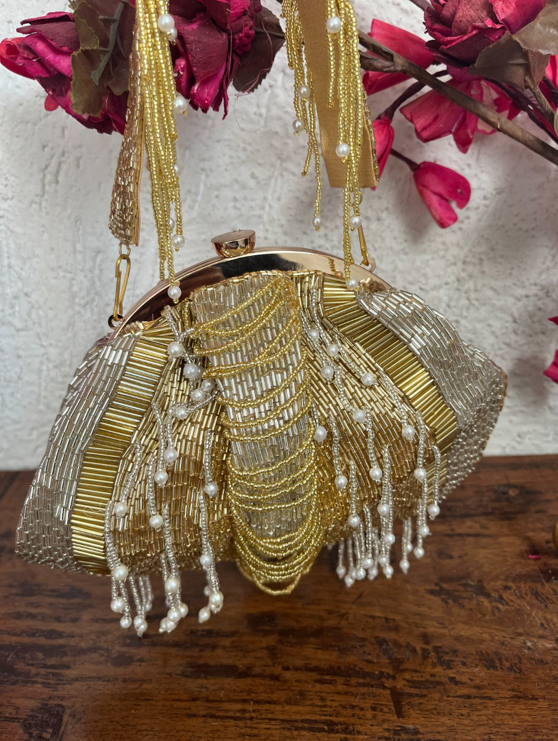 Gold and silver batua bag