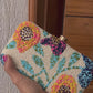white floral beaded clutch